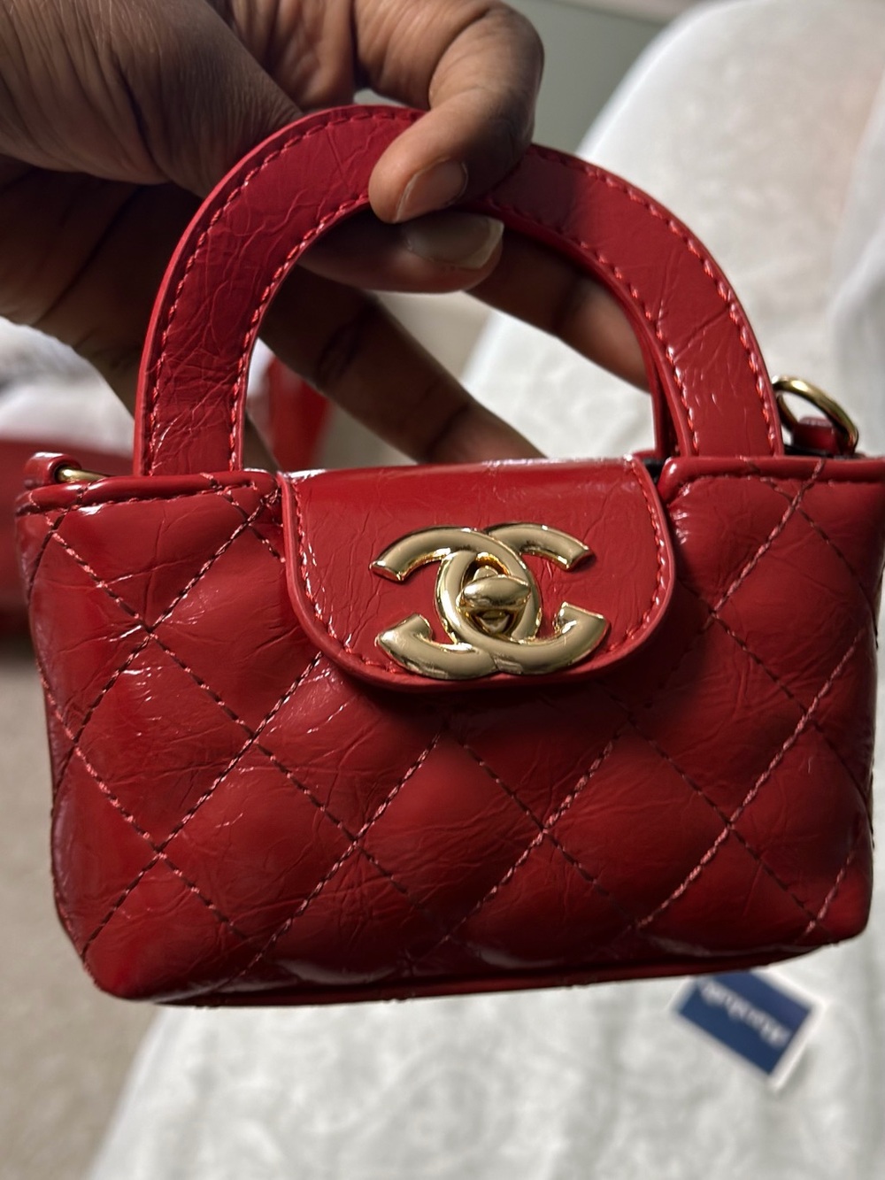 A Classy Chic Boutique Quilted Patent Mini Top-Handles in Red. Not Authentic.